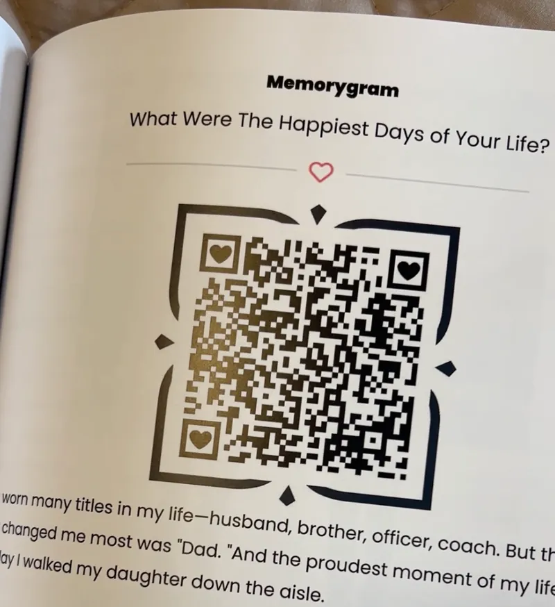 A printed page headed &ldquo;What Were The Happiest Days of Your Life?&rdquo; with a large QR code that plays back the storyteller&rsquo;s own recording